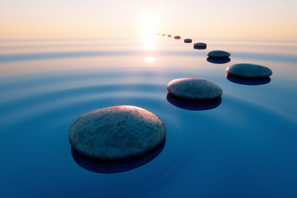 Row,Of,Stones,In,Calm,Water,In,The,Wide,Ocean