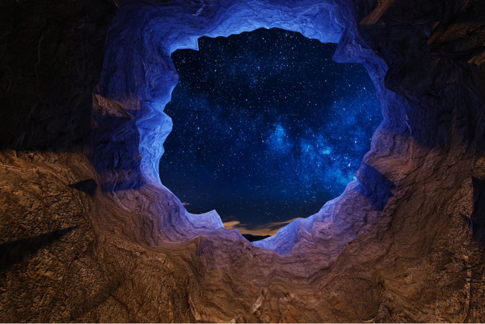 A cave with a hole looking at the night sky over a horizon - 3D illustration